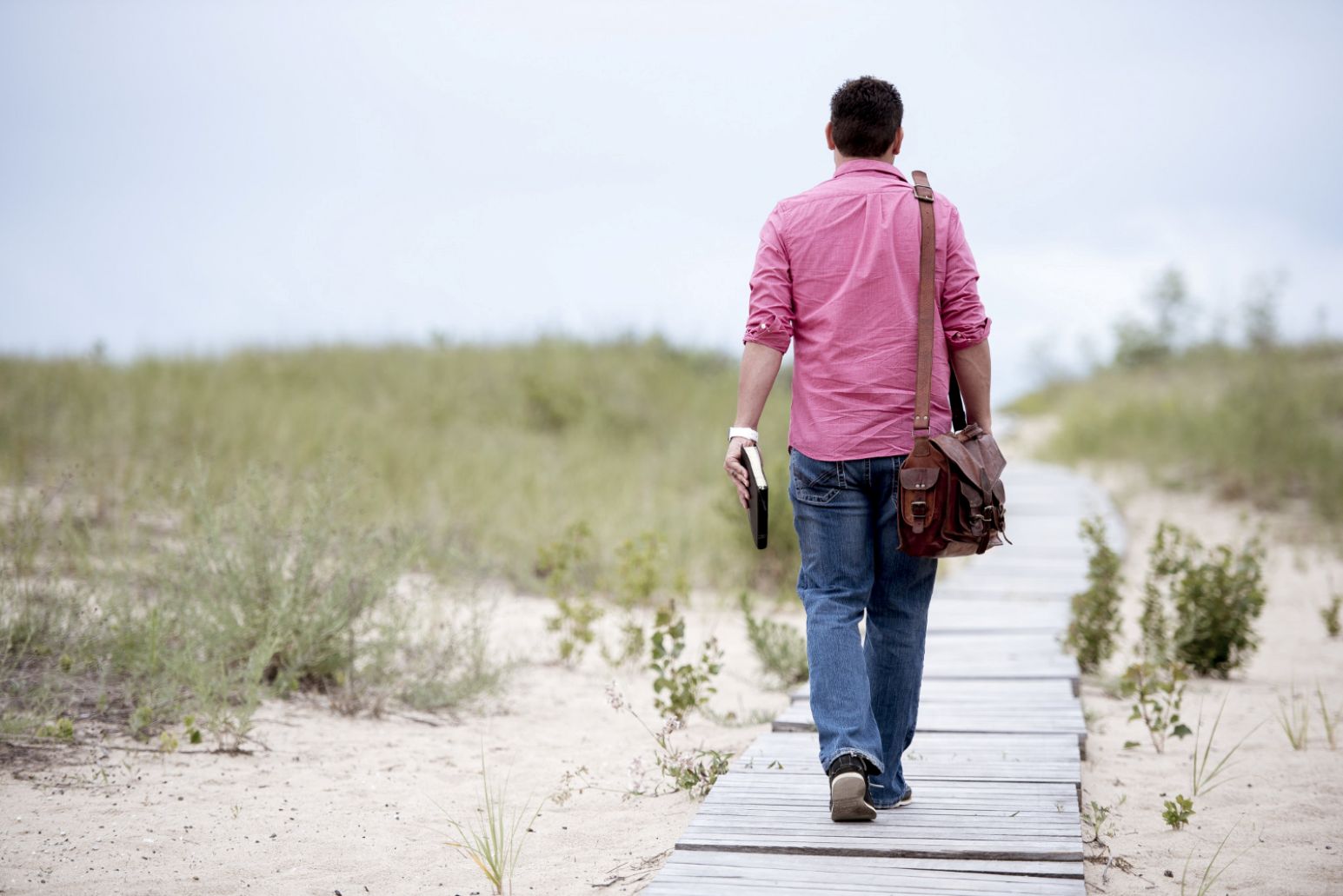 A man starting his Christian faith journey with a Bible in hand.