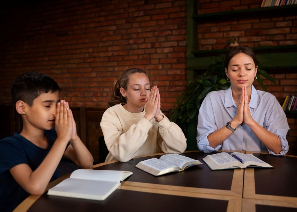 A family meditating on Scripture.