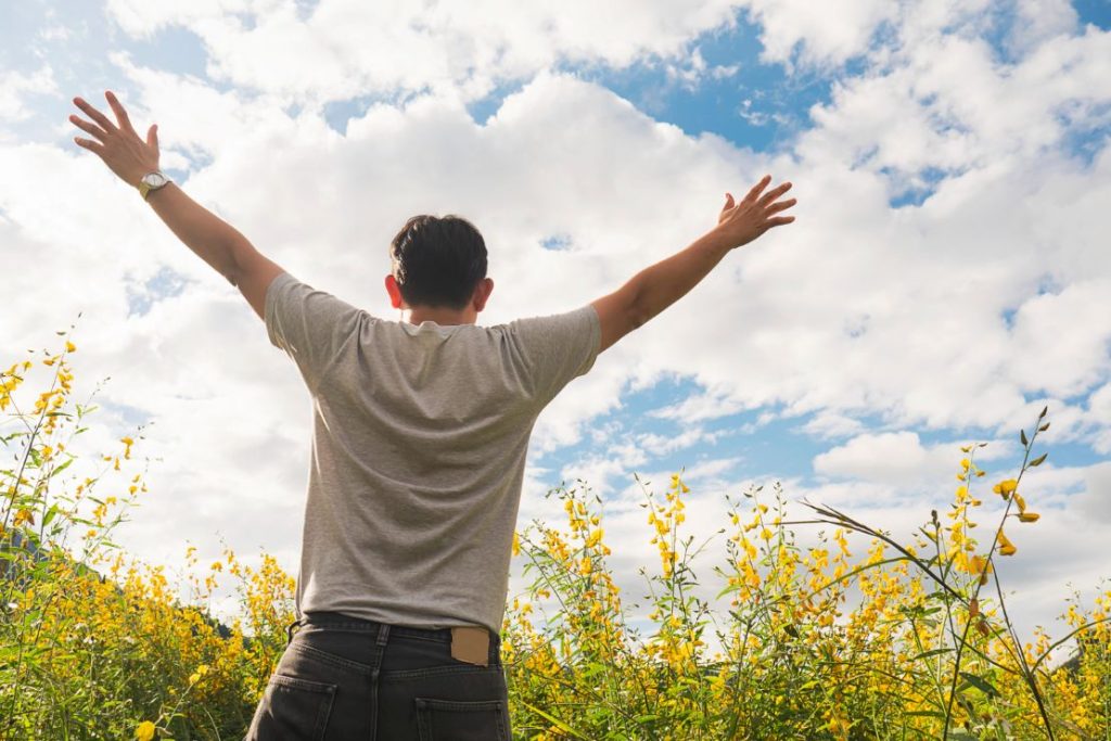 A man embracing the light and the sky.