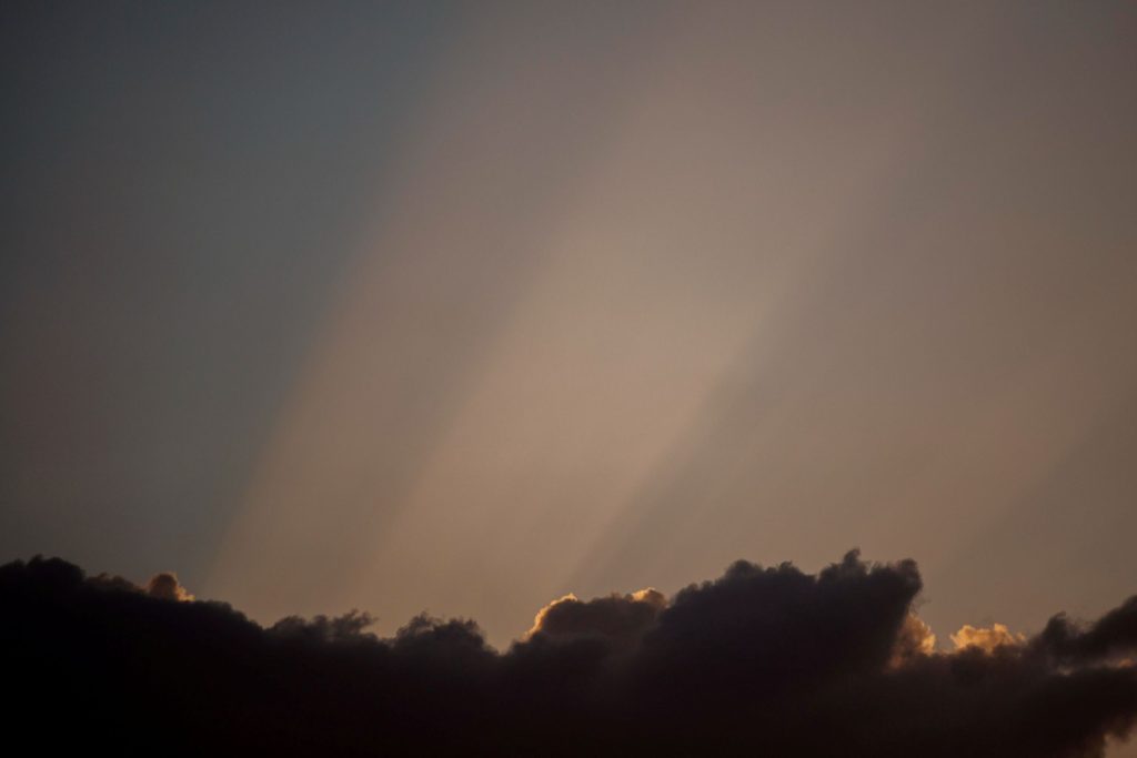 Dawn breaking through the clouds.