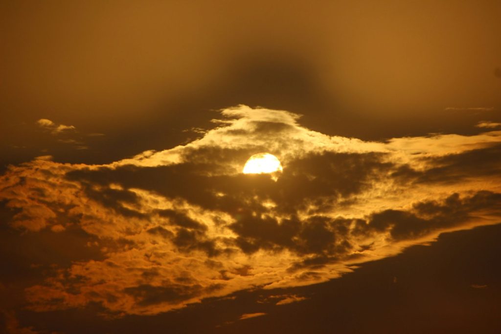 The sun breaking through the clouds.