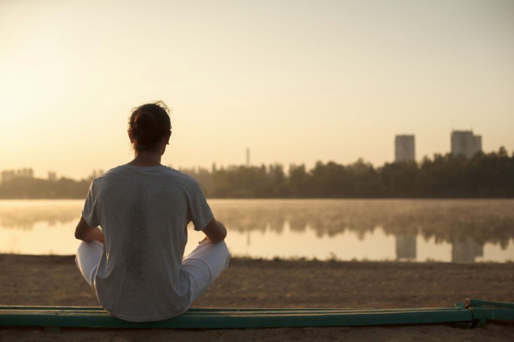 A man sitting in peace and tranquility.
