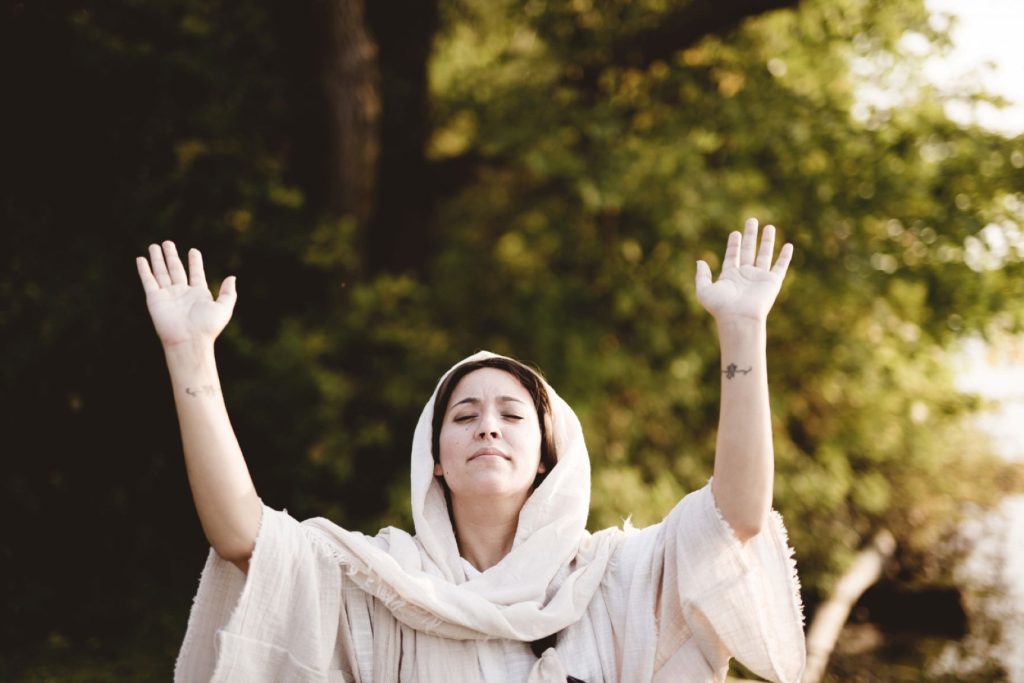 A devout follower of Christ being lifted up.