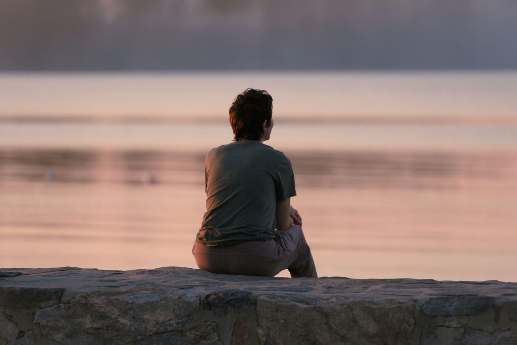 Woman looking at the sunrise.