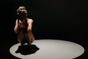 cast all anxiety a scared woman crouching